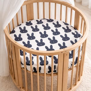 stokke mini fitted sheet with rabbit print.