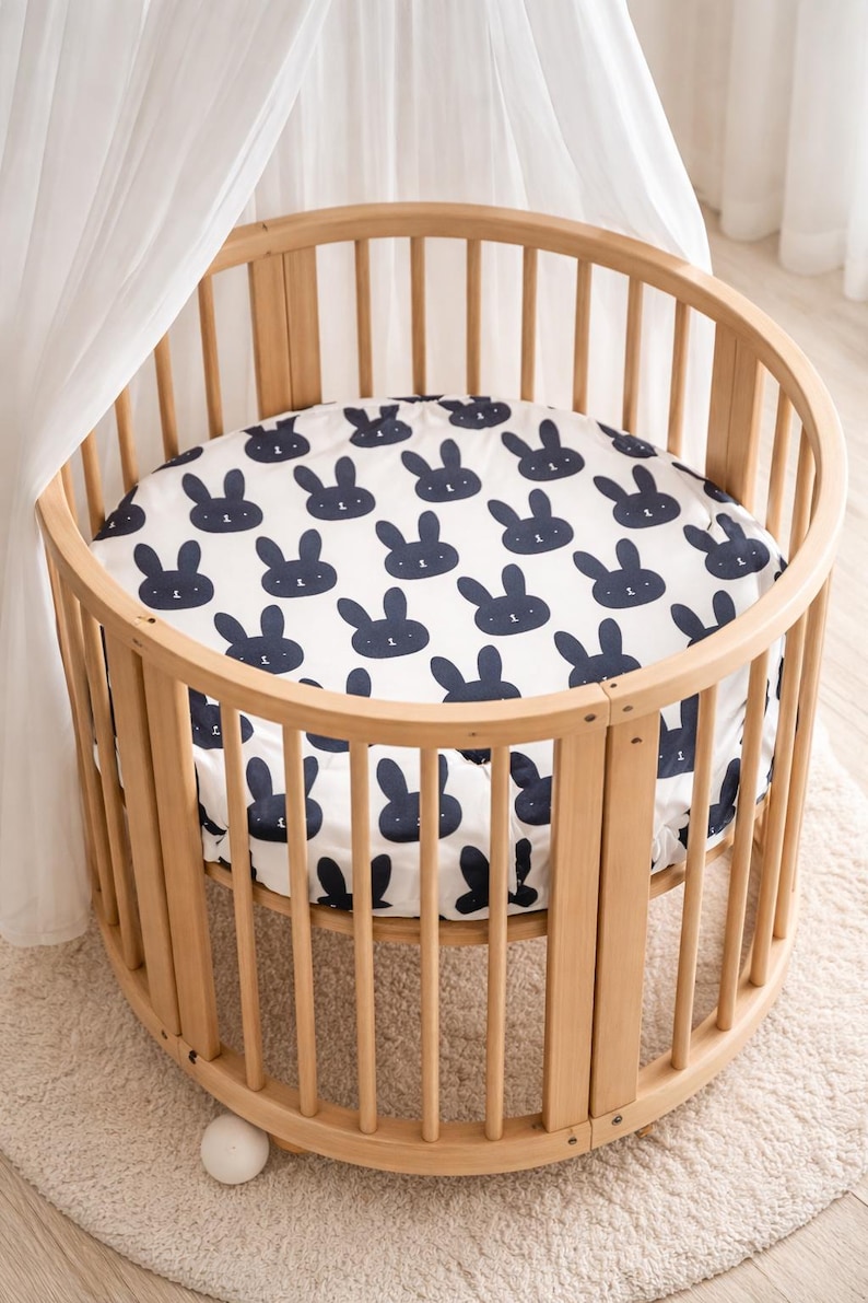 stokke mini fitted sheet with rabbit print.
