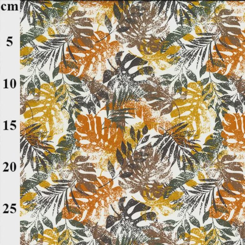 May include: A fabric sample featuring a tropical leaf pattern. The design includes large, stylized leaves in shades of brown, orange, yellow, and green, set against a white background. The pattern repeats across the fabric, creating a textured effect.