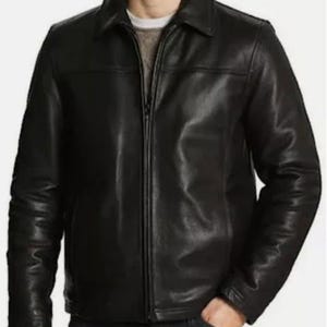 May include: A black leather jacket with a collared neckline and a front zipper closure. The jacket has long sleeves and a classic design. The person is wearing a gray sweater underneath. The jacket is a standard fit.