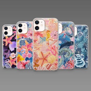 May include: Five phone cases with colourful underwater-themed designs. Each case features illustrations of starfish, seahorses, coral, and other marine life. The cases are in various colours, including pink, blue, and purple, and are designed to fit a mobile phone.