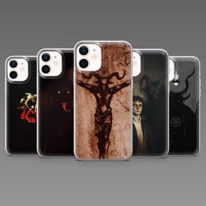May include: A collection of phone cases featuring dark, gothic artwork. The designs include images of a rose, a horned figure, a demonic entity, and a pentagram. The cases are clear with the artwork visible.