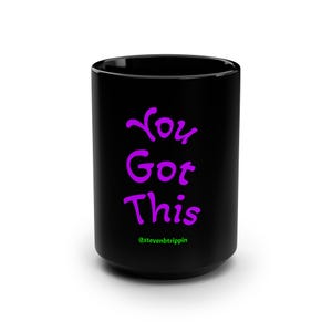 May include: A black ceramic mug with the words "You Got This" in purple script. The mug also features the Instagram handle @stevenbtrippin in green at the bottom. The mug has a glossy finish.