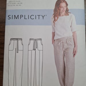 May include: A Simplicity S9050 sewing pattern envelope featuring a white top and striped pants with a drawstring waist. The cover displays technical line drawings of two pant variations labeled B and C, alongside a photograph of the finished pants.
