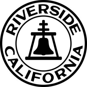 May include: A circular black and white emblem featuring the text RIVERSIDE CALIFORNIA in a bold sans-serif font around the perimeter. In the center, a black silhouette of a bell hangs within a frame, topped with a cross-like structure.