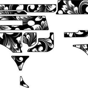 May include: Black and white floral pattern vinyl decal set. The design features a detailed, swirling floral motif. The set includes various shaped pieces, likely for application on a larger surface. The overall aesthetic is ornate and decorative.