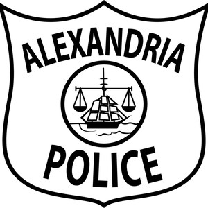 May include: Black and white Alexandria Police badge. The shield-shaped emblem features the words "ALEXANDRIA POLICE" in bold, sans-serif font. A circular emblem in the center depicts a ship, scales, and a mast.
