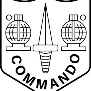 May include: Black and white Commando emblem. The emblem features a shield shape with a dagger in the center, flanked by two globe-like objects. The word "COMMANDO" is written in bold letters along the bottom of the shield.