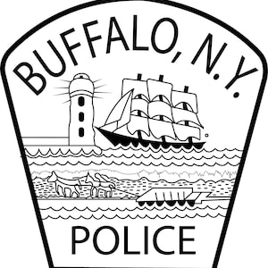 May include: Black and white Buffalo, N.Y. Police badge. The badge features a lighthouse, a three-masted ship, and a team of horses pulling a carriage. The word "POLICE" is at the bottom of the badge.