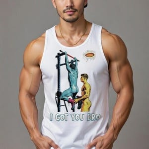 May include: A white vest top featuring a cartoon illustration of two figures, one blue and one yellow, on a pull-up bar. The text "I GOT YOU BRO" is below the image. The person is wearing a black baseball cap and a gold chain.