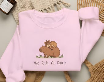Montamos al amanecer sudadera Capybara, gráfico Gildan 18000, cuello redondo de gato Kawaii, regalo amante de Capybara, animal caótico