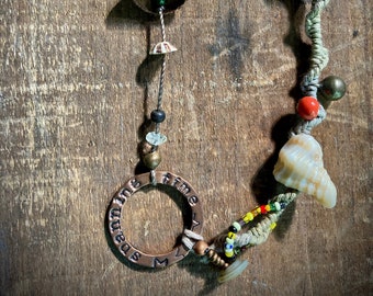 found-bit talisman: "spanning time" with shells, nuts, buttons and beads on hemp