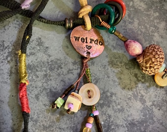 found-bit talisman: "weirdo" stamped penny, buttons, shoelace, acorn, jobs' tear and beads