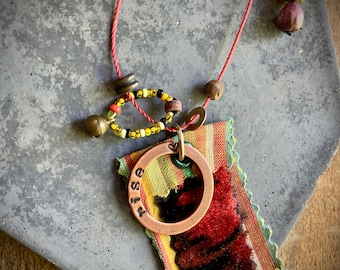 found-bit talisman: "rise" with fabric, beads and bits