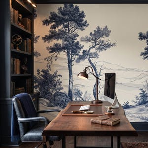 May include: A home office with a large wooden desk, a blue velvet armchair, and a matching chair. The room features a built-in bookshelf, a window with blue curtains, and a scenic blue and white mural wallpaper.