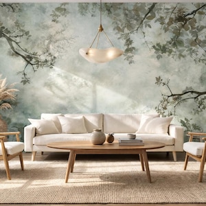 May include: A living room scene featuring a white sofa, two armchairs, and a wooden coffee table on a woven rug. The wall is adorned with a mural of a forest scene. A decorative light fixture hangs from the ceiling.