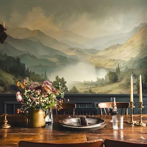 May include: A dining room scene featuring a wooden table set with a floral arrangement, candles, and a plate. The backdrop is a scenic mural of mountains and a lake. The room has a warm, inviting atmosphere, with a focus on natural elements.