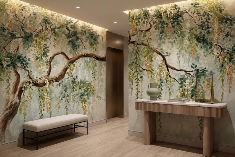 May include: A hallway featuring a mural of a large tree with green leaves and hanging yellow flowers. A light-colored bench with a black metal frame sits on the left, while a wooden console table with a white top stands on the right.