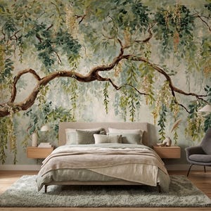May include: A large-scale wall mural featuring a detailed watercolor painting of a sprawling tree branch with hanging green leaves and yellow blossoms, set against a soft, muted background of light green and cream tones behind a bed.