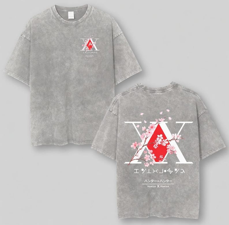May include: Gray t-shirt featuring a graphic design on the front and back. The front design includes a red diamond shape with white text and Japanese characters. The back design features a large white "X" with a red diamond and cherry blossom branches.