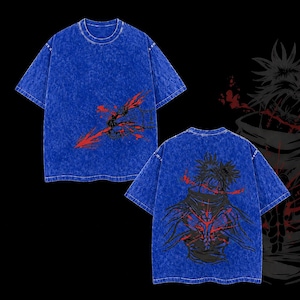 May include: Two blue t-shirts with graphic designs. One features a red and black arrow design on the front. The other displays a black and red character design on the back. The shirts have a textured finish.