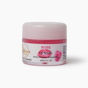 May include: A small, clear jar of rose-scented lip scrub with a pink lid. The label reads "ROSE Lip Scrub" and "Gentle Exfoliation & Moisturizing". The jar contains 0.7 fl oz of product.