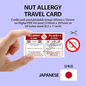 May include: A rectangular nut allergy travel card featuring text in English and Japanese, with a red and white design. The card includes a crossed-out nut icon, the text 'ALLERGY! to nuts!', and warnings about peanuts, tree nuts, and nut oils.