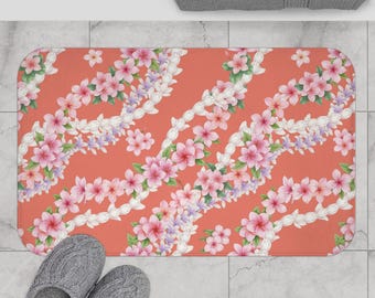Hawaiianische Plumeria und Crown Flower Lei Badematte Coral Hintergrund 2 Größen