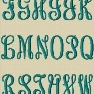 May include: A set of uppercase letters in a decorative script font, embroidered in teal blue on a beige background.