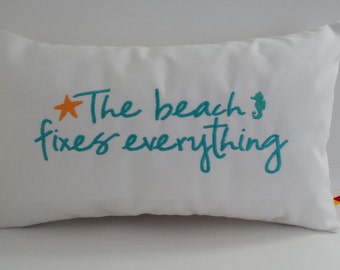 The BEACH FIXES EVERYTHING 12" x 20" custom embroidered lumbar pillow cover Sunbrella natural beach ocean Oba Canvas Co