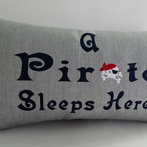 A PIRATE SLEEPS HERE 12" x 20" lumbar pillow cover Sunbrella granite indoor outdoor a pirate's life for me Oba Canvas Co copyrighted design