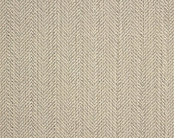 May include: A close-up of a beige fabric with a herringbone pattern.