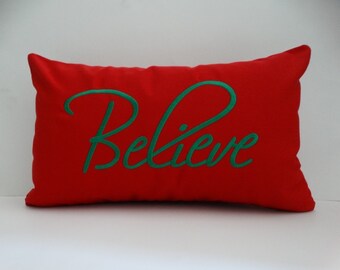 Sunbrella Christmas Pillow Cover: 'Believe' Holiday Throw Pillow (12x20)