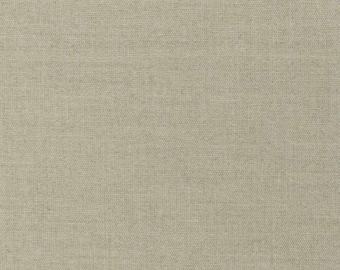May include: A close-up of a beige canvas fabric with a subtle woven texture.