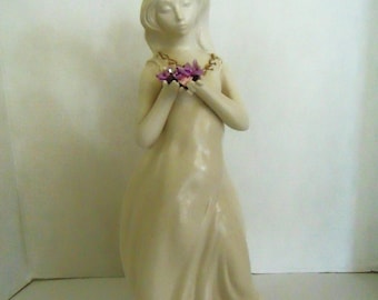Young Girl Porcelain Figurine carrying some flowers