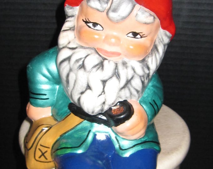 Featured listing image: Sitting Gnome enjoying his pipe.