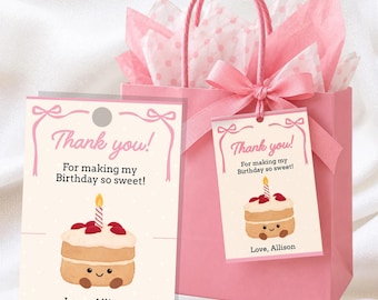 May include: A pink gift bag with pink polka dot tissue paper and a pink ribbon bow, accompanied by two rectangular tags featuring a cartoon cake with a lit candle and the text: Thank you! For making my Birthday so sweet! Love, Allison.