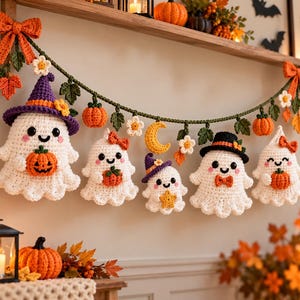 May include: A crochet garland featuring five white ghosts, orange pumpkins, a yellow crescent moon, and green leaves. The ghosts wear various accessories including a purple witch hat, orange bows, and a black top hat. The garland is accented with orange bows.