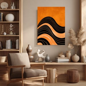 May include: An abstract wall art print featuring a wavy design in black, orange, and cream colors. The artwork is displayed in a living room setting with a wooden bookshelf, chair, and decorative items.