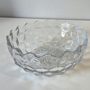 May include: A set of three ceramic mugs with a speckled, matte finish. The mugs are in shades of cream, light gray, and dark gray. Each mug has a simple, minimalist design, perfect for coffee or tea.