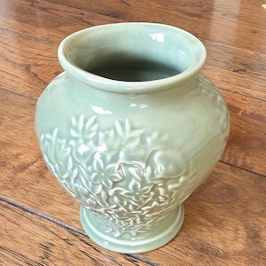 May include: A handmade wooden sign with the text "Welcome to our home" in a handwritten style. The sign is painted white with a distressed finish and a dark brown border. It is designed for indoor or outdoor use.