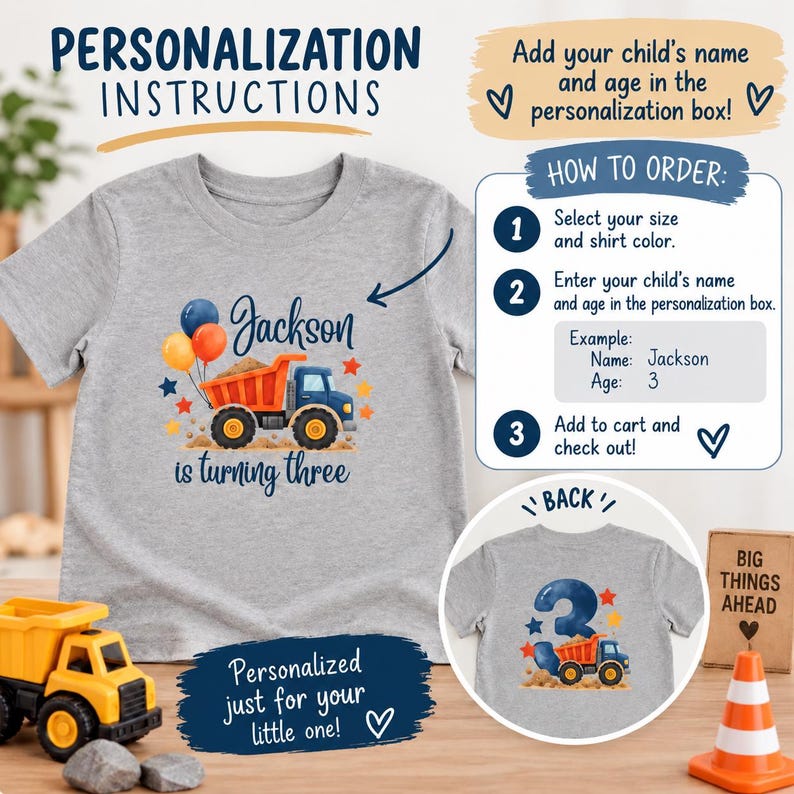 May include: A heather gray t-shirt featuring a graphic of an orange and blue dump truck with balloons and the text Jackson is turning three. A circular inset shows the back of the shirt with a large number three and a smaller dump truck graphic.