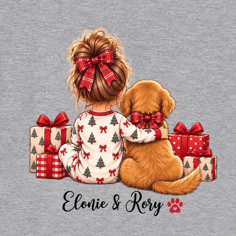 May include: A gray t-shirt featuring a graphic of a child with a red plaid hair bow and a golden dog with a red plaid bow, both sitting among wrapped Christmas gifts. The text "Elonie & Rory" is printed below with a red paw print icon.