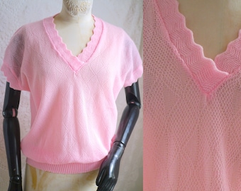 Deliziosa maglia gilet in maglia rosa confetto, senza maniche