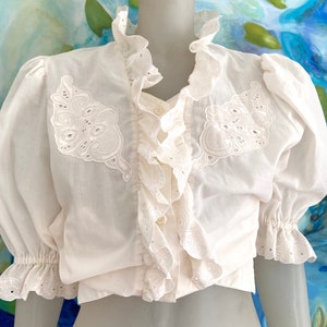 Vintage Victorian inspired blouse with ruffles and midi puff sleeves