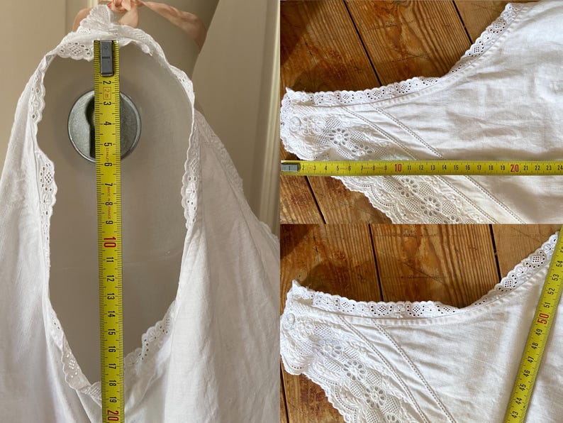 May include: White vintage top with lace trim, measuring approximately 20 inches in length. The top is displayed on a mannequin and features delicate lace detailing along the neckline and sleeves. The fabric appears to be a lightweight cotton or linen.