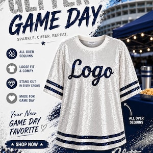 May include: A white short-sleeved jersey covered in silver sequins with dark blue stripes on the sleeves and hem. The word Logo is printed in dark blue script across the chest. The garment features a round neckline and a loose, relaxed fit.