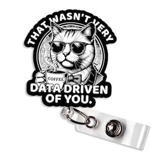 May include: A black and white sticker featuring a cat wearing sunglasses and a bow tie, holding a coffee cup. The sticker has the text "THAT WASN'T VERY DATA DRIVEN OF YOU."