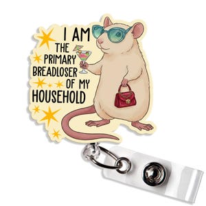 May include: A novelty badge reel featuring a cartoon rat wearing sunglasses and holding a cocktail and purse. The text on the badge reel reads "I AM THE PRIMARY BREADLOSER OF MY HOUSEHOLD". The reel has a white plastic clip and a metal retractable cord.
