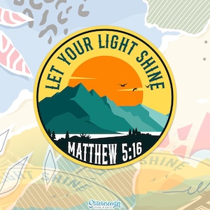 May include: A round sticker with a yellow border and the text "LET YOUR LIGHT SHINE". The sticker features a mountain landscape with an orange sun, teal mountains, and the text "MATTHEW 5:16".